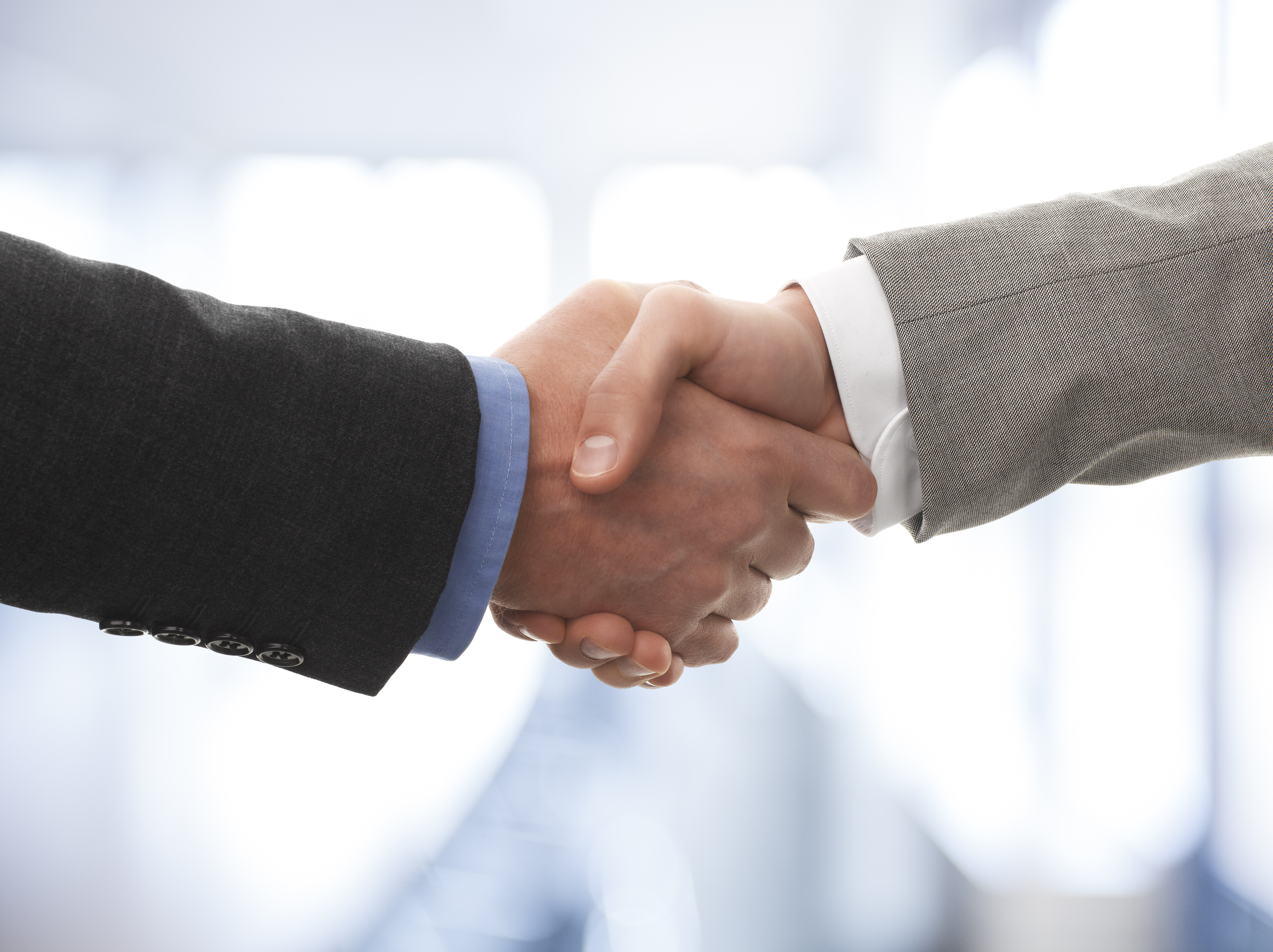 Two business men shaking hands